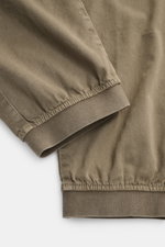 Close-up front view of elastic leg cuffs on Stone Island Cargo Jogpants grey-green, made from soft, garment-dyed organic cotton fabric.