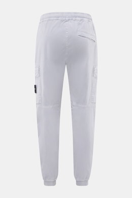 Rear view of Stone Island Cargo Jogpants smoky blue, showing elastic waistband, cargo pockets, and elastic leg cuffs in tapered fit.

Description: <p>For everyone who wants to combine function and style: These cargo jogpants by STONE ISLAND are inspired b