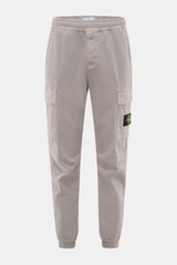 Front view of Stone Island Cargo Jogpants grey in tapered fit with elastic waistband, cargo pockets, and compass badge.

Description: For everyone who wants to combine function and style: These cargo jogpants by STONE ISLAND are inspired by classic utilit