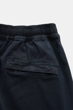 Close-up rear view of Stone Island Cargo Jogpants navy showing elastic waistband and back pocket with snap button, made from soft, garment-dyed organic cotton with stretch for comfort and style. For everyone who wants to combine function and style: These 