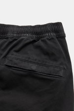Close-up rear view of Stone Island Cargo Jogpants black showing elastic waistband and back pocket with snap button.

Description: For everyone who wants to combine function and style: These cargo jogpants by STONE ISLAND are inspired by classic utility 