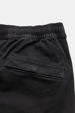 Close-up rear view of Stone Island Cargo Jogpants black showing elastic waistband and back pocket with snap button.

Description: For everyone who wants to combine function and style: These cargo jogpants by STONE ISLAND are inspired by classic utility 