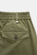 Close-up rear view of PT Torino Jogger pants 'The Rebel' green, showing elasticated waistband, buttoned back pocket, and textured cotton-linen blend fabric. The jogger pants 'The Rebel' by PT TORINO have a comfortable elasticated waistband, a regular fit 