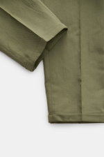 PT Torino Jogger pants 'The Rebel' green shown from a close-up side angle, highlighting the cropped cut, fixed hem turn-up, and fabric texture. The jogger pants 'The Rebel' by PT TORINO have a comfortable elasticated waistband, a regular fit and a cropped