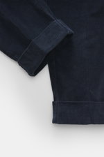 Close-up top-down view of Berwich Corduroy pants 'Chiaia' navy showing folded ankle cuffs and soft, slightly elastic cotton corduroy texture.