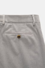 Close-up rear view of Berwich Corduroy pants 'Retrolong' grey, showing piped welt back pocket with button, soft cotton-cashmere corduroy, regular tapered fit, zipper and waistband buttons, extended button flap, single waistband pleat, open length, embodyi