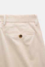 Close-up rear view of Berwich Corduroy pants 'Retrolong' sand, showcasing cotton and cashmere corduroy, soft feel, regular fit, tapered design, zipper and waistband buttons, extended button flap, single waistband pleat, piped hip pockets, welt back pocket