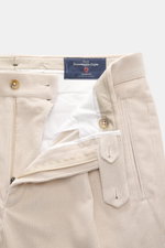 Close-up front view of Berwich Corduroy pants 'Retrolong' sand, showing open waistband, zipper, buttons, and soft cotton-cashmere fabric.