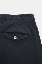 Santaniello Chino 'Camerota' navy close-up from the back shows buttoned flap back pocket, waistband with belt loops. Casual style, soft elastic cotton twill with single pleat at waistband, tapered fit, regular thigh width, ankle-length, zipper and waistba
