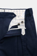 Close-up front view of PT Torino Cotton trousers 'Carrot Fit' navy, twill pure cotton, heavy, slightly elastic, soft touch, zipper with buttons, extended tab, double waistband pleat, small watch pocket visible.