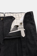 Close-up front view of PT Torino Jeans 'Rebel Fit' dark navy melange with open waistband showing striped cotton-cashmere lining, button and zip closure, and fine textured, slightly elastic fabric for comfort and style.