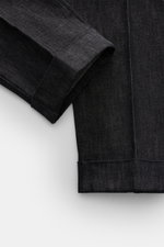 Close-up front-side view of the cuff and lower leg of PT Torino Jeans 'Rebel Fit' dark navy melange, made of fine cotton and cashmere blend with a slightly textured, elastic quality, featuring a tapered fit, regular thigh width, ankle-length narrowing, zi