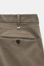 Close-up rear view of PT Torino Chino 'Slim Fit' gray cotton twill pants showing waistband, belt loop with PT logo, welt back pocket with button, and soft fabric texture. For these chinos, PT TORINO selects classic cotton twill in a soft quality and adds 