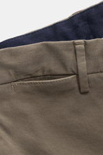 Close-up front view of PT Torino Chino 'Slim Fit' gray showing cotton twill fabric, belt loop, and navy waistband lining, soft feel, light stretch, slim tapered fit, zipper and waistband buttons, French pockets, small watch pocket, welt back pockets with 