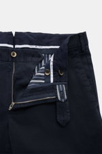 Close-up front view of PT Torino Chino 'Slim Fit' navy cotton twill pants with zipper, buttons, and striped inner lining, soft touch.
