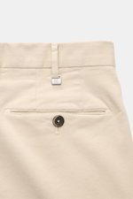 PT Torino Chino 'Slim Fit' sand shown from back waist close-up, classic cotton twill, light stretch, soft touch, zipper and waistband buttons, French pockets, small watch pocket, welted back pockets with button, perfect for versatile office looks.