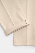 Close-up top-down view of PT Torino Chino 'Slim Fit' sand cotton twill fabric with soft touch and light stretch, showing folded cuff detail. 

Description: For this chino, PT TORINO chooses classic cotton twill in a soft quality and adds a slight stretch 