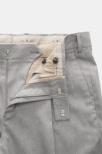 Close-up front view of PT Torino Pants 'Rebel Fit' grey melange, showing zipper, waistband hook, single pleat, and beige inner lining.