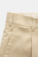Close-up front view of PT Torino Pants 'Rebel Fit' beige showing waistband, belt loops, single pleat, and French pocket in soft cotton-silk blend fabric. With PT TORINO you’re always on the right track: These comfortably cut pants in the trendy Tapered Fi