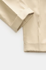 PT Torino Pants 'Rebel Fit' beige shown from close-up side angle, highlighting ankle-length tapered hem cuff in cotton-silk blend.