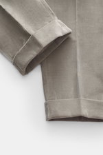 Close-up view of the ankle and lower leg of PT Torino Corduroy pants 'Rebel Fit' grey, showing corduroy made of pure cotton with slightly elastic quality, very soft feel, tapered fit, regular thigh width, ankle length, very narrow tapering, zipper and wai