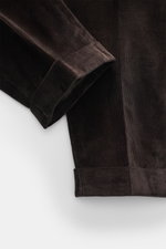 Close-up top-down view of PT Torino Corduroy pants 'Rebel Fit' dark brown, featuring corduroy made of pure cotton, slightly elastic quality, very soft feel, tapered fit, regular thigh width, ankle length, very narrow tapering, zipper and waistband hook, s