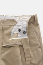 Close-up front view of PT Torino Chino 'Hamptons' beige showing twill pure cotton fabric, soft touch, tapered fit, zipper, waistband buttons, and striped inner lining.