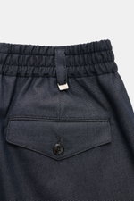 Close-up rear view of PT Torino Trousers 'The Rebel' grey blue melange showing elastic waistband, buttoned flap pocket, and metal initial.

Description: <p>Comfort meets style: The 'The Rebel' trousers from PT TORINO impress with a stretch twill made of c