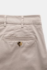 Close-up back view of Brunello Cucinelli Chinos 'Italian Fit' sand, showing twill fabric, buttoned back pocket, belt loops, and stitching details.