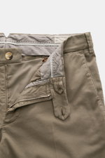 Close-up front view of Brunello Cucinelli Chinos 'Italian Fit' sage, showing zip, waist buttons, French pockets, and soft garment-dyed cotton twill.