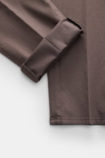 Brunello Cucinelli Chinos 'Italian Fit' grey brown shown from a close-up, angled top-down perspective, highlighting the elasticated cotton twill fabric with a soft feel and garment-dyed finish. These versatile classic trousers feature a regular fit, taper