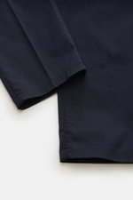 Close-up top view of Brunello Cucinelli Chinos 'Italian Fit' navy showing soft, elasticated cotton twill fabric and tapered hem detailing.