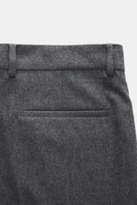 Close-up rear view of Brunello Cucinelli wool trousers dark grey melange showing welt pockets, belt loops, and soft pure virgin wool fabric.

Description: <p>These wool trousers of the luxury label BRUNELLO CUCINELLI are a true classic among trouser model
