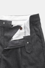 Close-up front view of Brunello Cucinelli wool trousers dark grey melange showing waistband, zipper, button, and inner lining details.

Description: <p>These wool trousers of the luxury label BRUNELLO CUCINELLI are a true classic among trouser models with