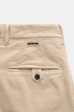 Close-up rear view of Incotex Corduroy Pants Beige showing cotton corduroy fabric, slightly elastic quality, soft touch, regular fit, very tapered cut, zip fly, double waistband pleat, French pockets, and piped back pockets with button.