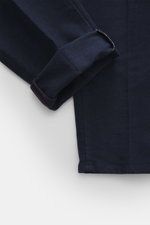 Incotex Cotton trousers navy shown from a close-up side angle, twill made of slightly elastic cotton, soft brushed quality, tapered fit, narrow tapering, double waistband pleat, zipper and waistband button, french pockets, back pockets with button, tonal 