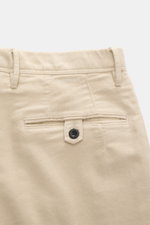 Close-up rear view of Incotex Cotton trousers sand showing twill slightly elastic cotton, soft brushed quality, tapered fit, narrow tapering, zipper and waistband button, double waistband pleat, french pockets, back pockets with button, and tonal logo sti