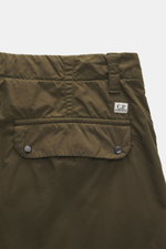 C.P. Company Cargo pants olive shown from the back close-up, made of high-quality microfiber with soft feel, tapered fit, straight short cut, zipper and waistband button, French pockets, practical cargo pockets, back pocket with flap, and label-typical le