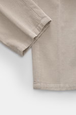 Close-up top view of Briglia 1949 Corduroy pants beige showing soft cotton-modal fabric, tapered ankle-length leg and ribbed texture.