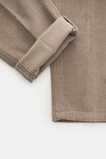 Close-up view of Briglia 1949 Corduroy pants taupe showing soft cotton-modal fabric with light stretch, ribbed texture, and folded cuff from above.