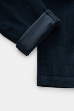Close-up top view of Mason's Corduroy Pants 'Torino Style' navy showing soft, slightly elastic cotton and lyocell fabric with folded cuff.