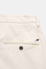 Close-up view from the back of Mason's Chino 'Torinostyle' cream pants, slim and tapered fit, mix of modal, cotton, microfiber, soft touch, zipper and waistband buttons, french pockets, piped back pockets with button, typical metal initial.