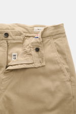 Close-up front view of Mason's Chino 'Torinostyle' beige pants showing zipper, waistband buttons, french pockets, slim and tapered fit, soft touch mix of modal, cotton, and microfiber, piped back pockets with button, and typical metal initial.