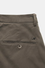 Close-up rear view of Mason's Chino 'Torinostyle' dark grey pants showing piped back pockets with button, typical metal initial, slim tapered fit, zipper and waistband buttons, french pockets, made from a soft touch mix of modal, cotton, and microfiber.