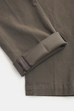Close-up top-down view of Mason's Chino 'Torinostyle' dark grey folded leg, showing soft touch fabric with a mix of modal, cotton and microfiber, slim tapered fit, zipper and waistband buttons, french pockets, piped back pockets with button, and typical m