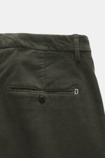 Close-up of Dondup Corduroy pants 'Spiritissimo' dark green, showing back pockets with button, belt loop, and metal initial from above. Especially comfortable, velvety fine cord made of elastic cotton makes the 'Spiritissimo' by DONDUP a must-have for the