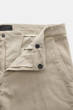 Close-up front view of Dondup Corduroy pants 'Spiritissimo' beige showing zipper, buttons, and fine elastic cotton cord fabric texture. 

Description: Especially comfortable, velvety fine cord made of elastic cotton makes the 'Spiritissimo' by DONDUP a mu