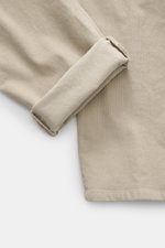 Close-up of beige Dondup Corduroy pants 'Spiritissimo' showing the fine elastic cotton corduroy fabric and folded cuff from above. Especially comfortable, velvety fine cord made of elastic cotton makes the 'Spiritissimo' by DONDUP a must-have for the casu