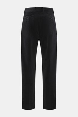 Rear view of Officine Générale Corduroy pants 'Hoche' black, showcasing soft, slightly elastic cotton corduroy, tapered fit, regular thigh width, ankle length with waistband, belt loops, button fly, side seam pockets, and back pockets with button, reflect
