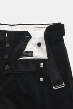 Close-up front view of Officine Générale Corduroy pants 'Hoche' black, showing button fly, waistband with belt, and soft ribbed texture. Parisian casualness with a modern claim: OFFICINE GÉNÉRALE presents the 'Hoche' pants, a timeless addition to the soph
